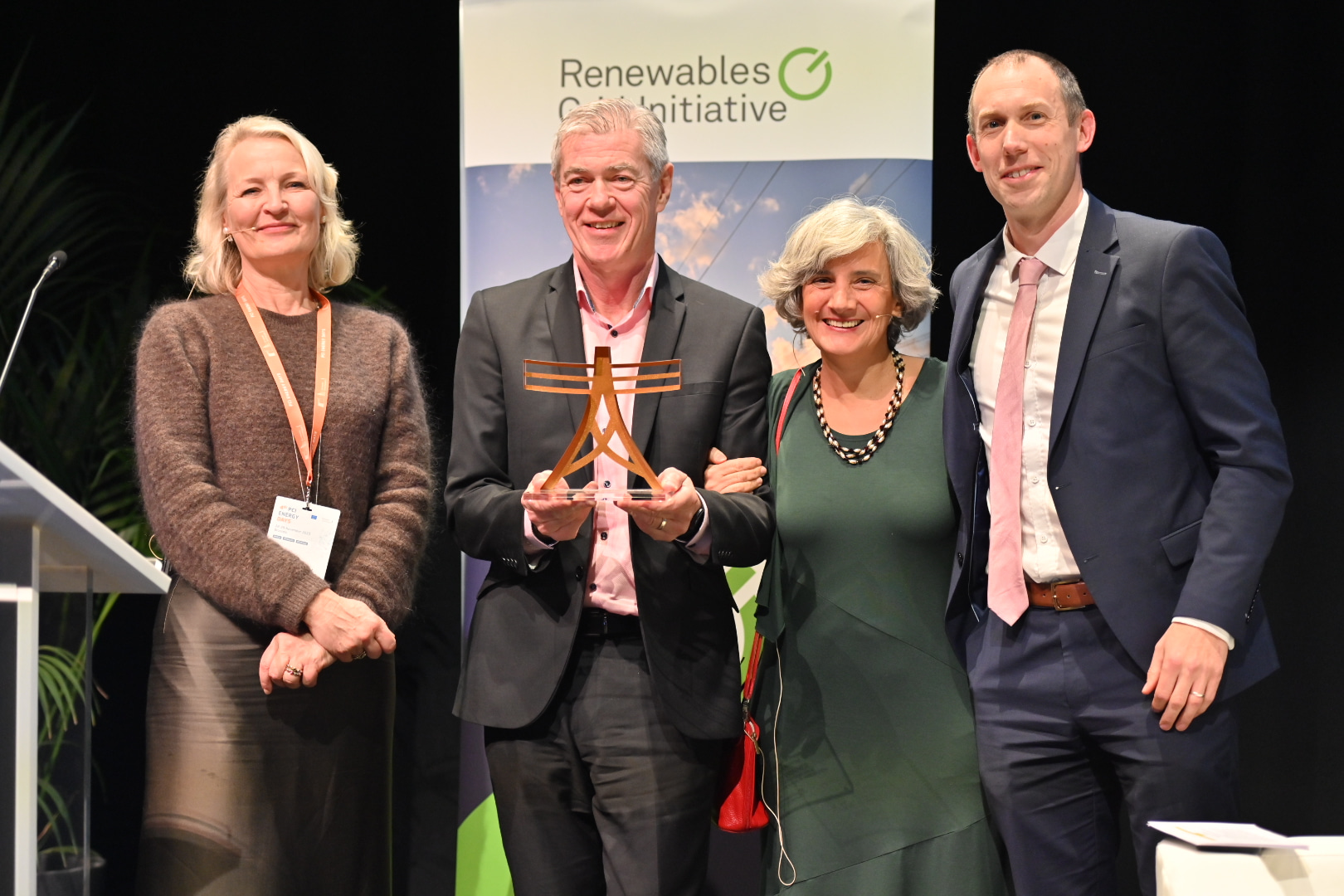 EirGrid CEO Mark Foley accepts a prize at the Renewables Grid Initiative Awards