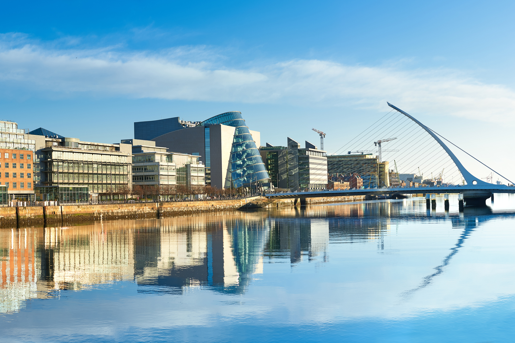 A view of Dublin's Convention Centre and Samuel Beckett Bridge from across the Liffey